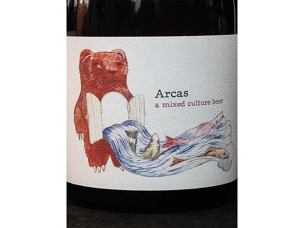 closeup of a beer bottle label that says, "Arcas, a mixed culture beer"