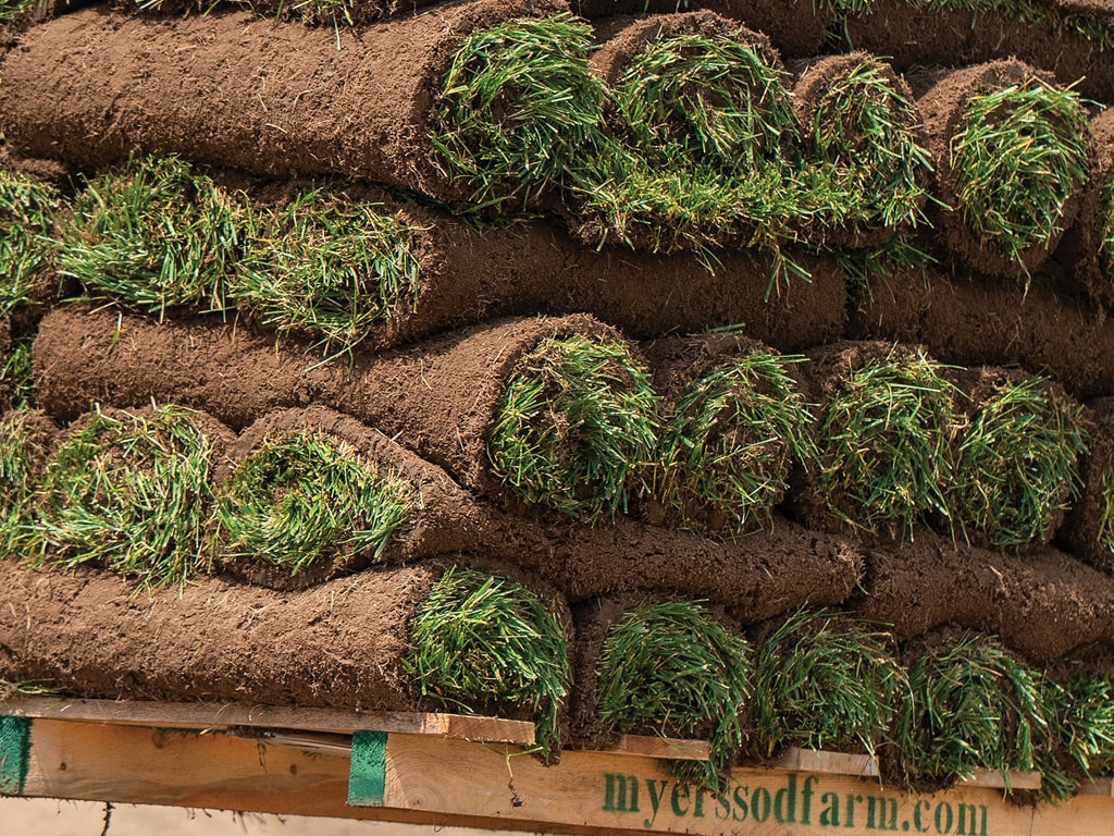 rolls of sod piled up in alternating perpendicular angles