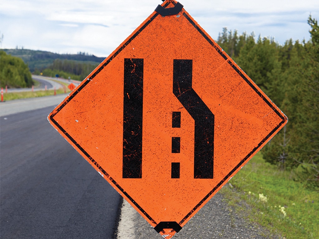 lane merge caution street sign