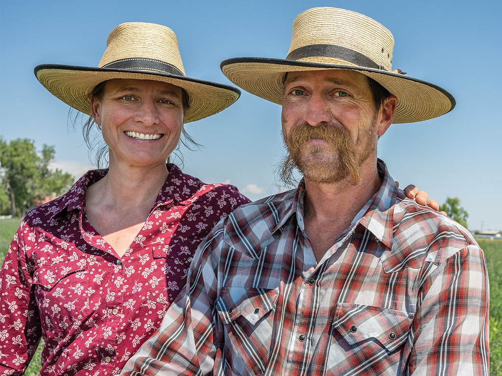 Heather and Bart in sunhats smiling