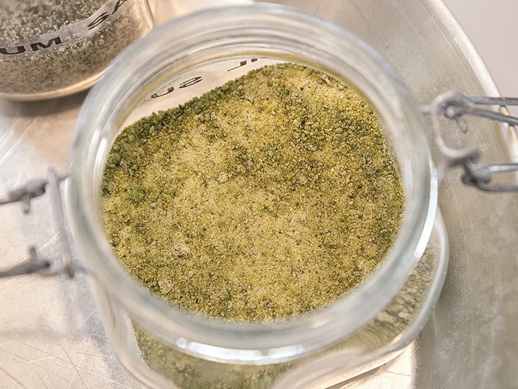 powdered herbs in a glass of jar