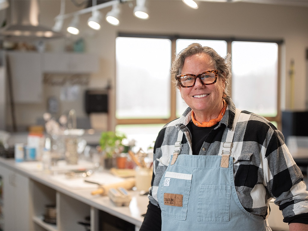 chef beth fisher standing in her kitchen