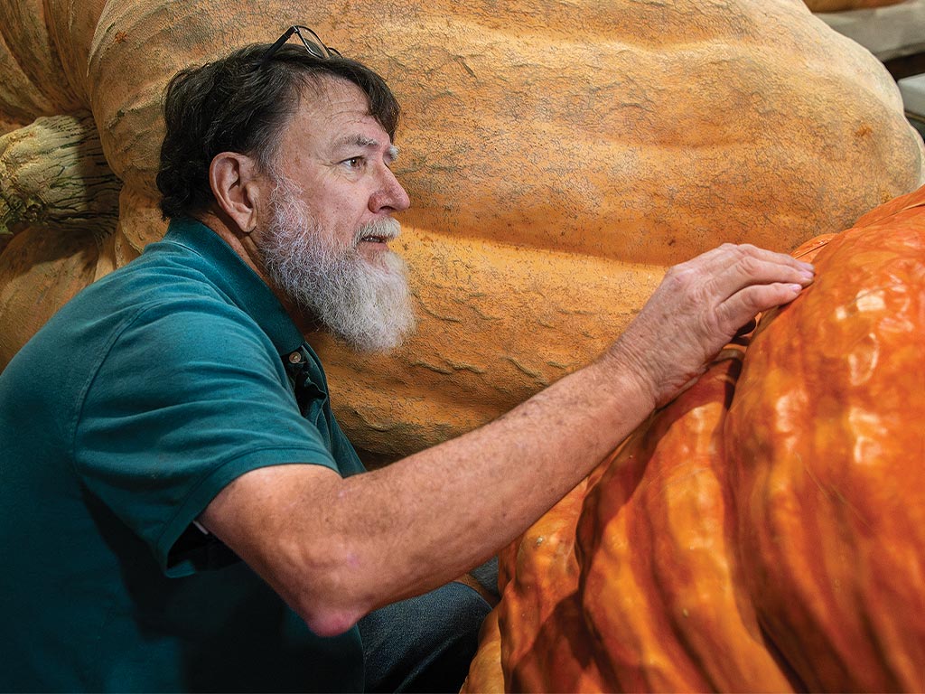 Bob Cohen next to a pumpkin