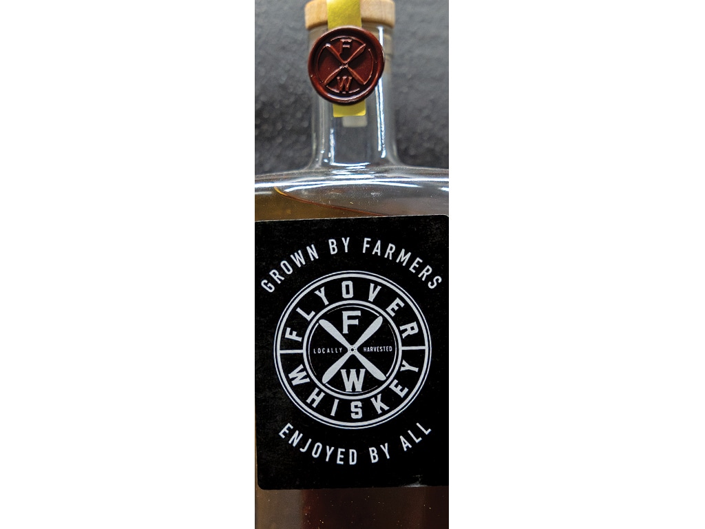 sealed bottle of whiskey with label displaying "Flyover Whiskey"