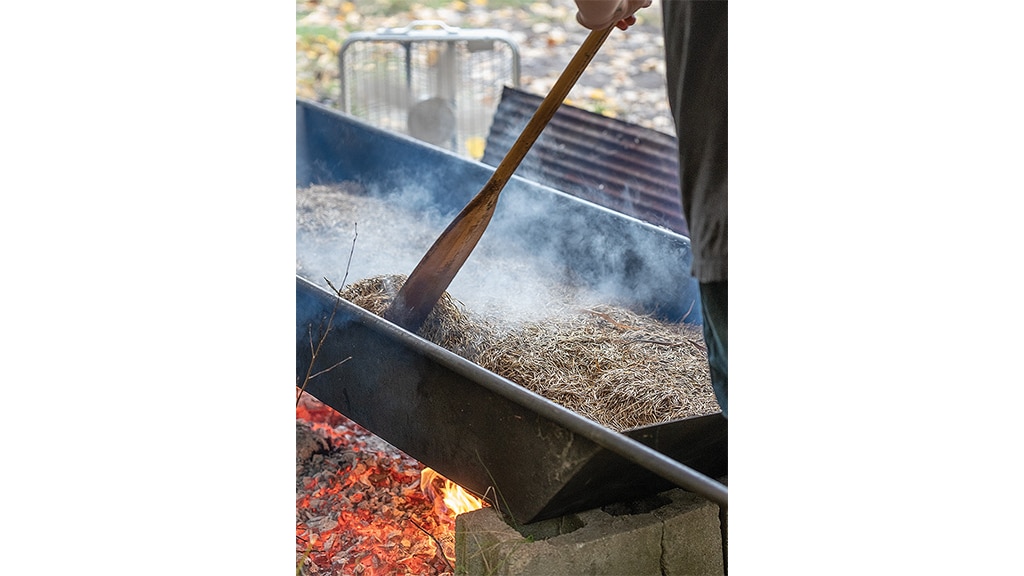 parching grains over an open fire vessel