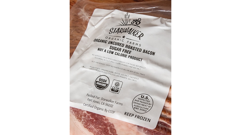 bacon packaging labeled Starwalker Organic Farms Organic uncured roasted bacon sugar free not a low calorie proiduct