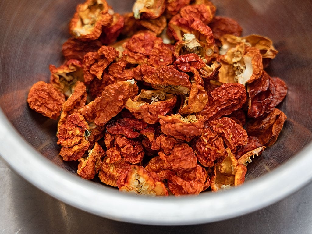 A bowl of sundried chicken in a bowl.